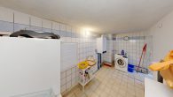 Waschkueche - Behagliches Einfamilienhaus mit Balkon, Kamin & Nebengebäude – perfekt für ruhiges, zentrales Wohnen
